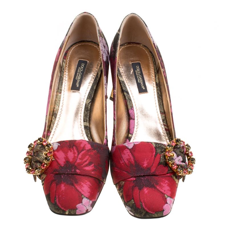 We rarely get to see creations as elegant as these pumps from Dolce and Gabbana. They've been wonderfully designed using floral-printed jacquard fabric and decorated with crystal studded buckles on the vamps and shiny gold block heels which are
