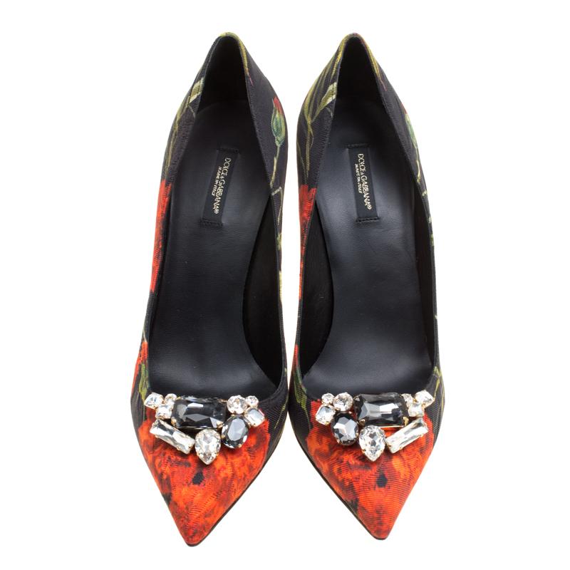 Resplendent, ravishing and regal, these pumps from Dolce and Gabbana will surely add sparks of luxury to your wardrobe! These pumps are crafted from jacquard fabric and feature a beautiful floral print all over them. They flaunt pointed toes with