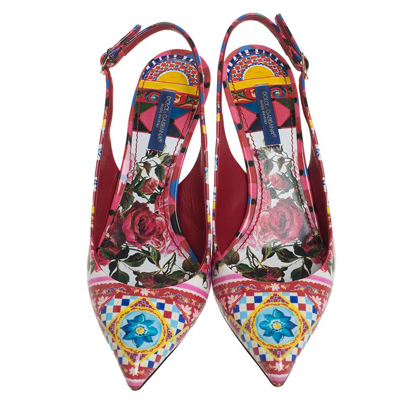 Wear these stylish sandals from the house of Dolce & Gabbana and channel your inner fashionista. These sandals are crafted from patent leather and come in a multicolored floral print. They are styled with pointed toes, buckled slingbacks, gold-tone
