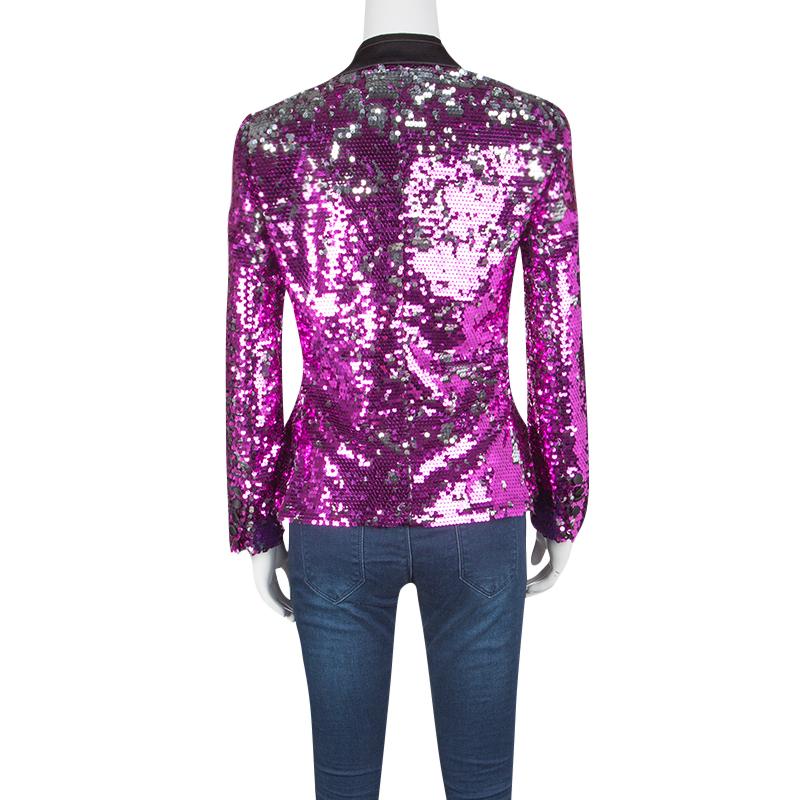 Designed in the most stunning and statement fuscia pink sequin paillette embellishment, this stunning Dolce and Gabbana blazer is a perfect party piece. Featuring a grey velvet trim lapel collar, this blazer also features button details along the