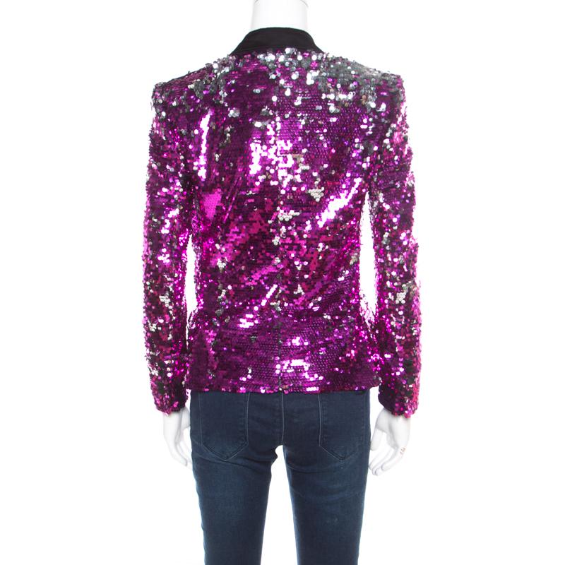 Designed in the most stunning and statement fuscia pink sequin paillette embellishment, this stunning Dolce and Gabbana blazer is a perfect party piece. Featuring a grey velvet trim on lapel collar, this blazer also features button details along the