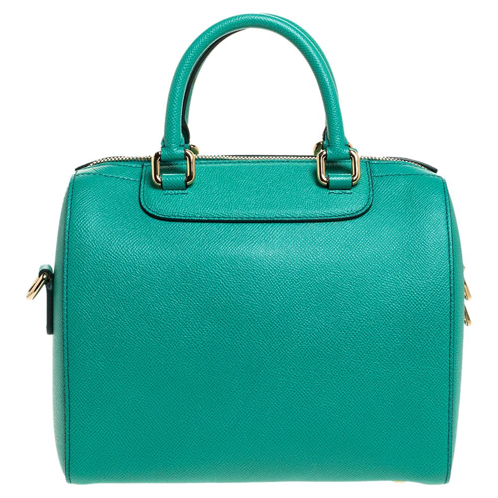 This chic Boston Bag by Dolce & Gabbana will enhance both your casual and evening wear. Crafted from leather in green, it is colorful and glamorous. The bag is equipped with two handles and a zip closure that opens to a fabric interior. Swing this