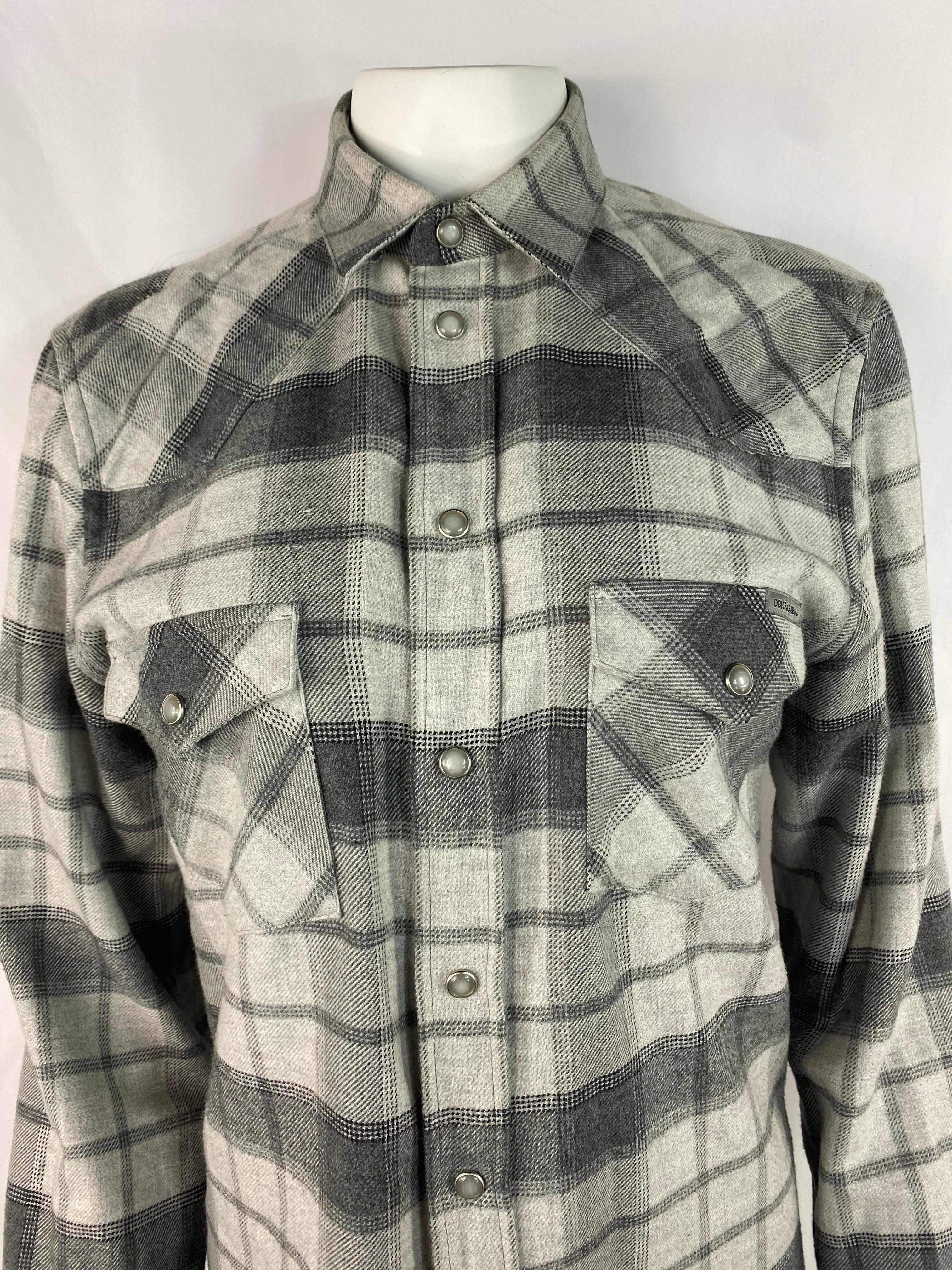 Product details:

The shirt features grey color palette with check/ plaid print and dual front pocket detail. Made in Italy.