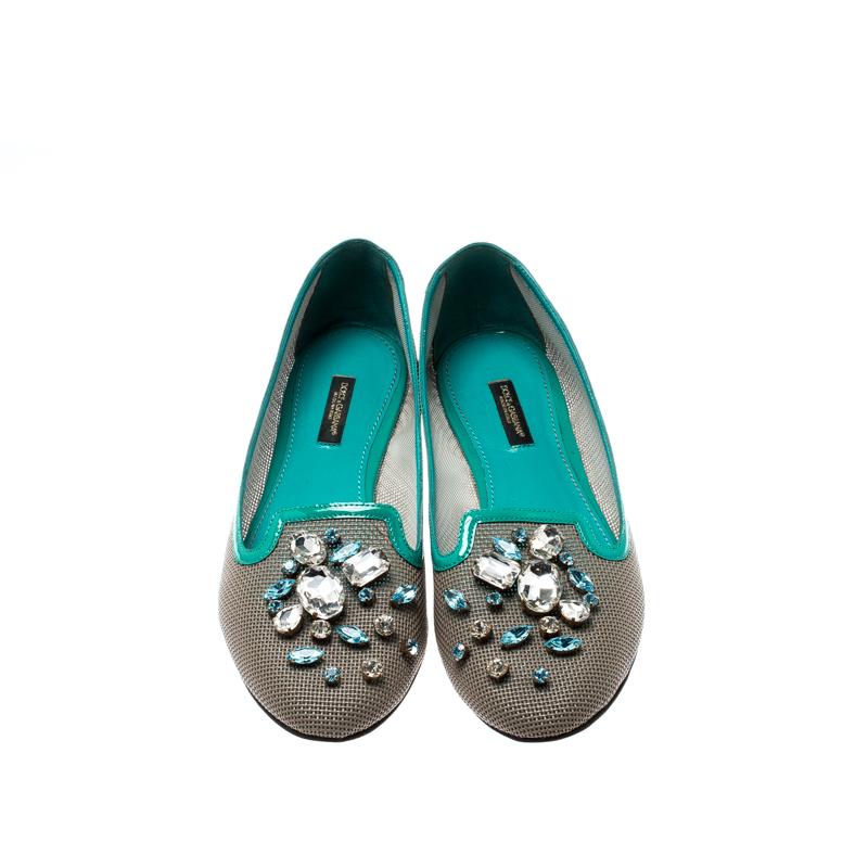 This beautiful and adorable pair of ballet flats from Dolce and Gabbana will complete your outfit. It is crafted from leather and patent leather. This pair of flats are adorned with attractive crystal embellishments. They come with leather-lined