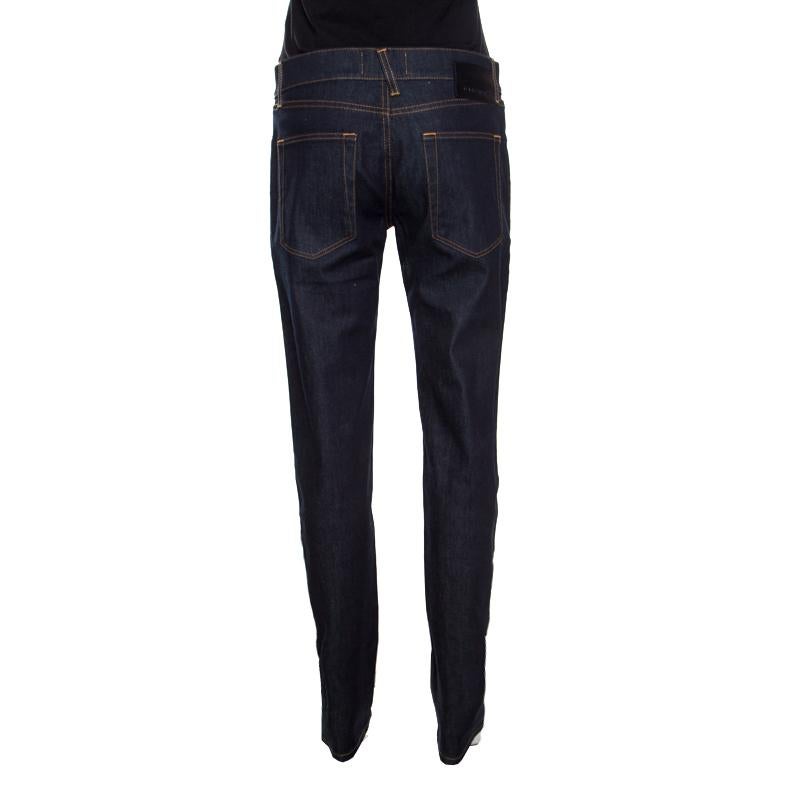 These indigo jeans from Dolce & Gabbana are perfect for your casual style. The jeans are made of cotton and feature a straight fit design. They flaunt a button fastening at the front along with belt loops and you can wear it with sneakers or high