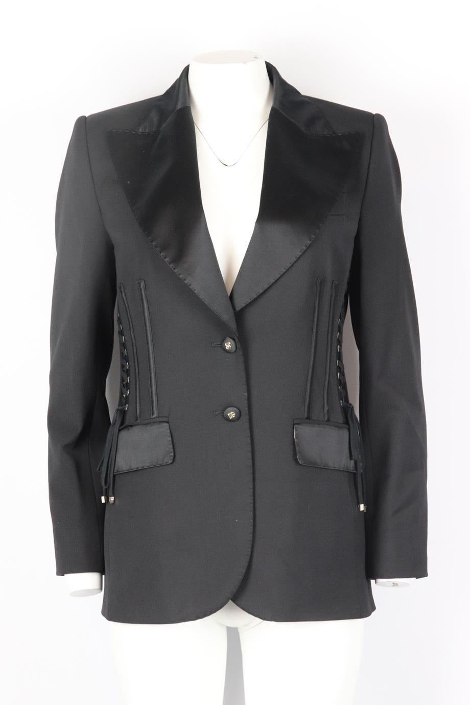 Dolce & Gabbana lace up wool and silk blend blazer. Black. Long sleeve, v-neck. Button fastening at front. 77% Wool, 16% silk, 5% polyester, 2% elastane; lining: 100% silk. Size: IT 44 (UK 12, US 8, FR 40). Shoulder to shoulder: 16 in. Bust: 34 in.