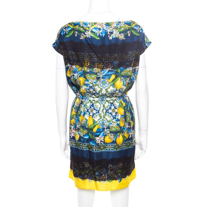 This Dolce and Gabbana dress has everything that you are looking for in a fashion-forward and elegant dress. Satisfying and trendy for all seasons, this creation, made from a silk and cotton blend, is a chic staple. It is adorned with a quirky lemon