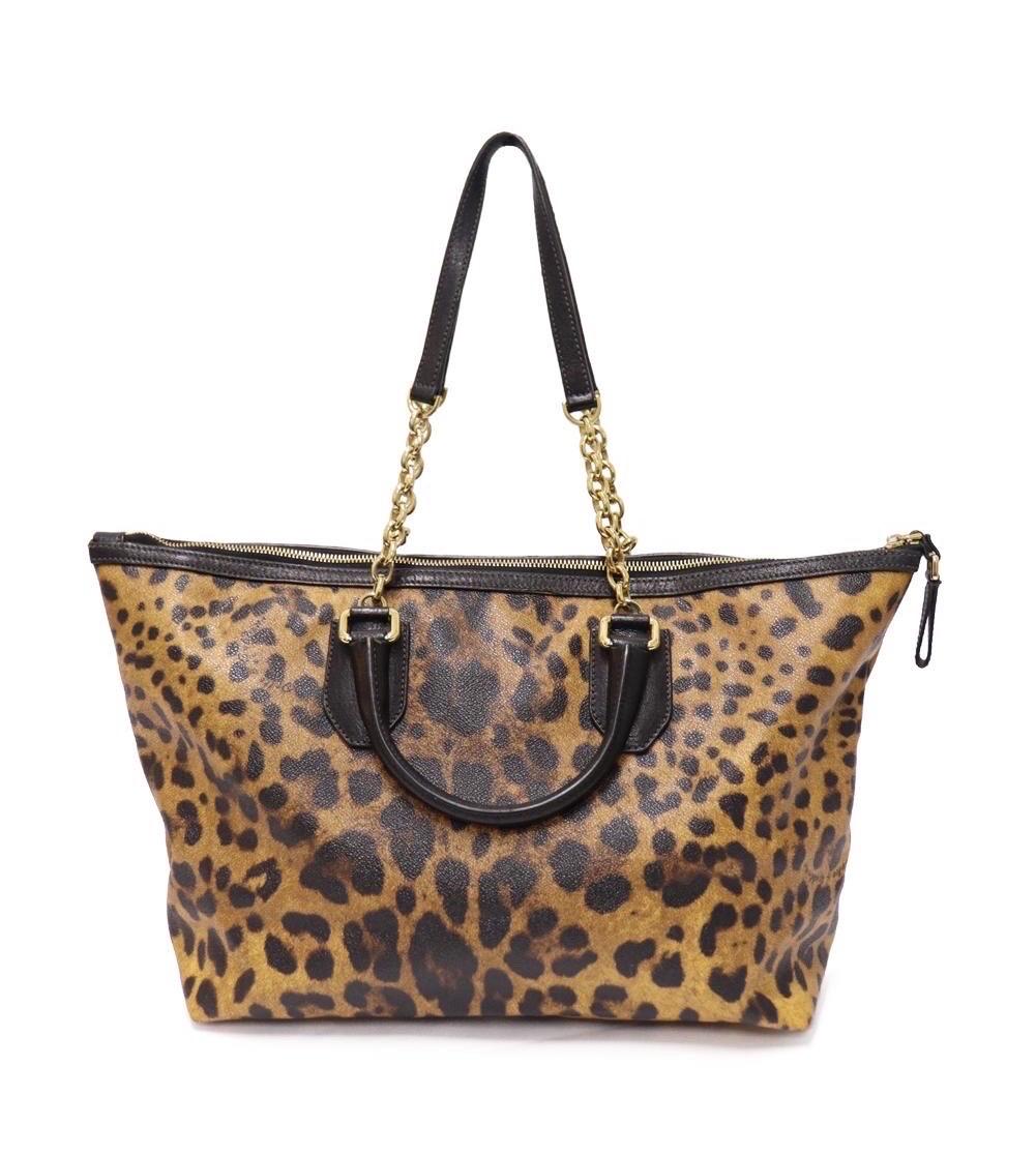 Dolce and Gabbana Leopard Print Canvas Tote with two pockets, including one zipper pocket.

Material: Leather
Hardware: Gold
Height: 27cm
Width: 34cm
Depth: 15cm
Handle Drop: 23cm
Overall condition: Excellent.
Interior condition: Like New.
External