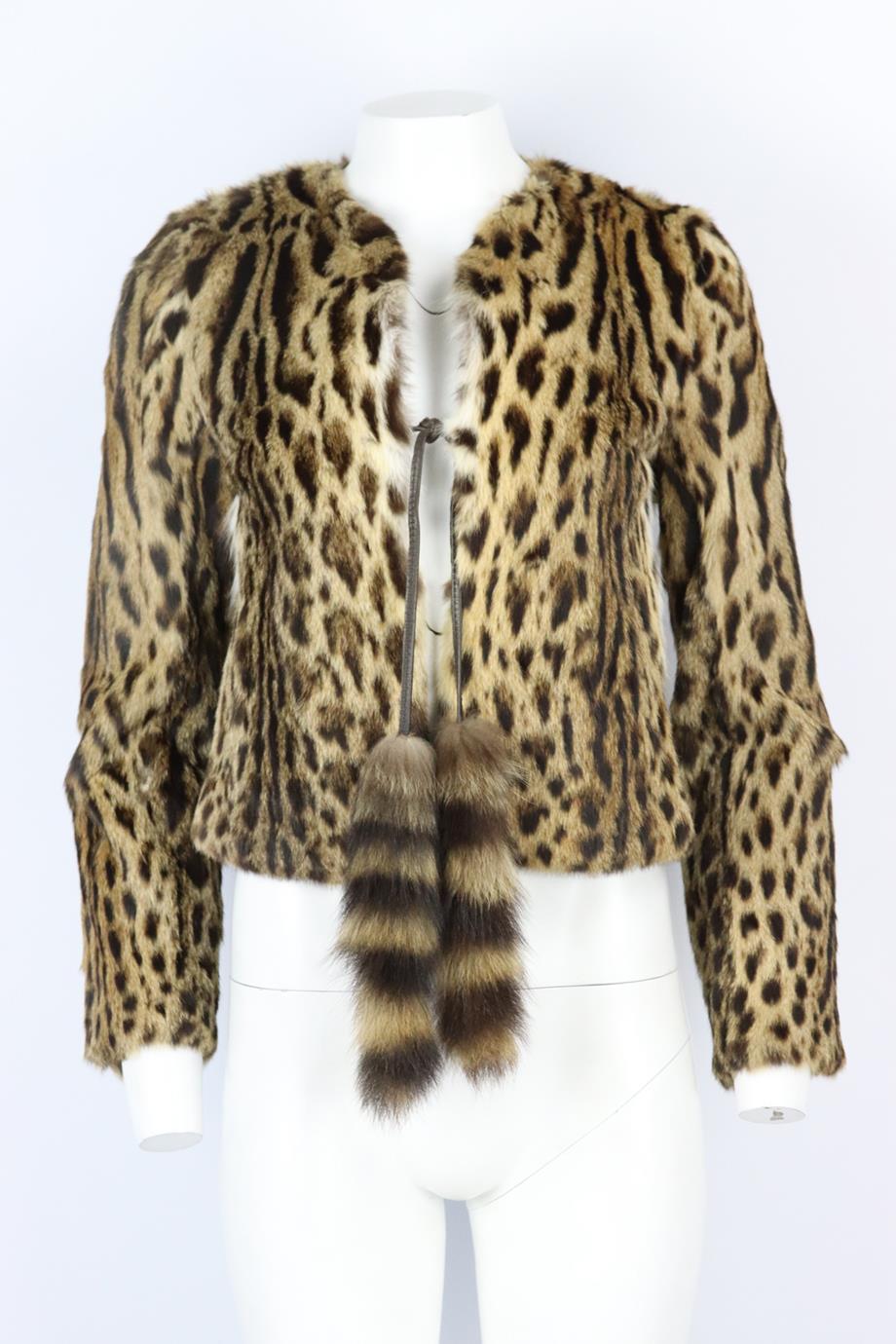 Dolce & Gabbana leopard print fur jacket. Beige, brown and black. Long sleeve, crewneck. Tie fastening at front. 100% Leopard cat; fabric2: 100% Lambs leather; fabric3: 100% marmot; lining: 100% viscose. Size: IT 40 (UK 8, US 4, FR 36). Shoulder to