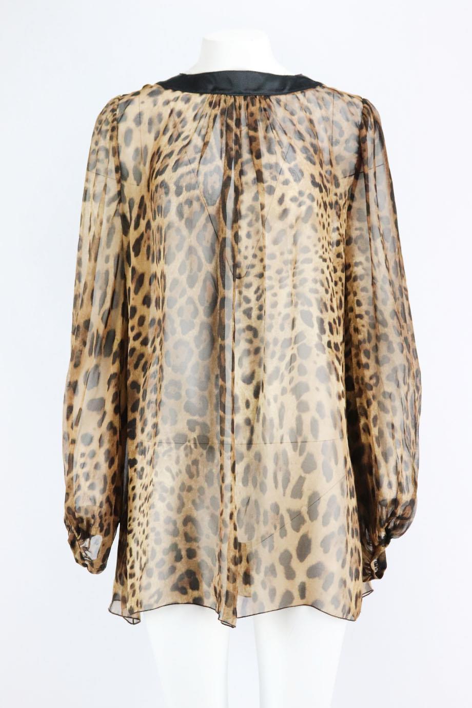 Dolce & Gabbana leopard print silk top. Brown, beige and black. Long sleeve, v-neck. Slips on. 100% Silk. Size: IT 44 (UK 12, US 8, FR 40). Bust: 46 in. Waist: 49 in. Hips: 74 in. Length: 31 in. Very good condition - No sign of wear; see pictures.
