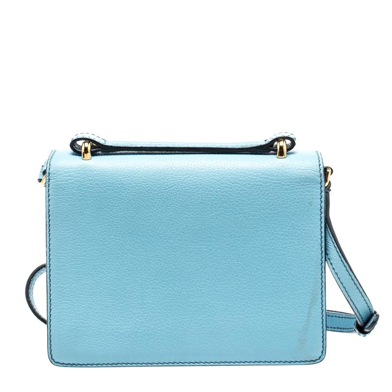 This chic Rosalia crossbody bag by Dolce&Gabbana will enhance both your casual and evening wear. Crafted from light blue leather, it features a turn-lock closure on the front flap, an adjustable shoulder strap, and a single flat top handle. The bag