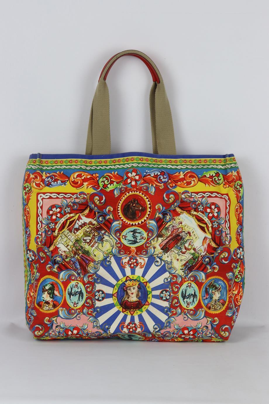 Dolce And Gabbana Maria Printed Canvas Tote Bag. Multi. Open Top. Does not come with - dustbag or box. 60% polyamide, 30% polyurethane, 5% leather, 3% rubber, 2% cork. Height: 16 in. Width: 4.2 in. Depth: 15 in. Handle drop: 8 in. Condition: Used.