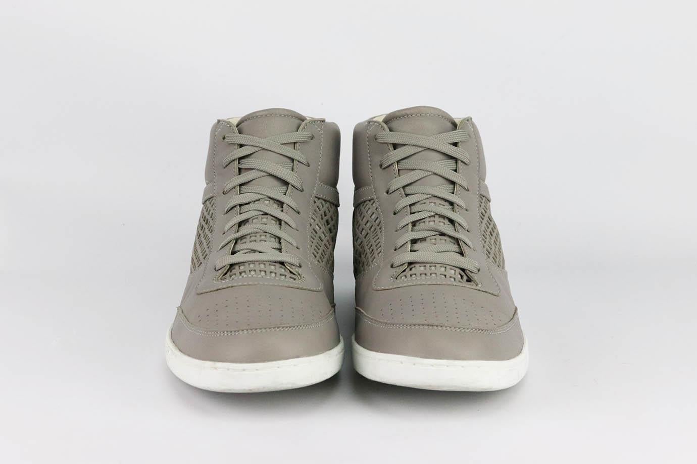 These high-top sneakers by Dolce & Gabbana is just as cool as the last - they're made from breathable leather and have padded collars and embossed logo on the back. Rubber sole measures approximately 25 mm/ 1 inches. Grey leather. Lace up fastening