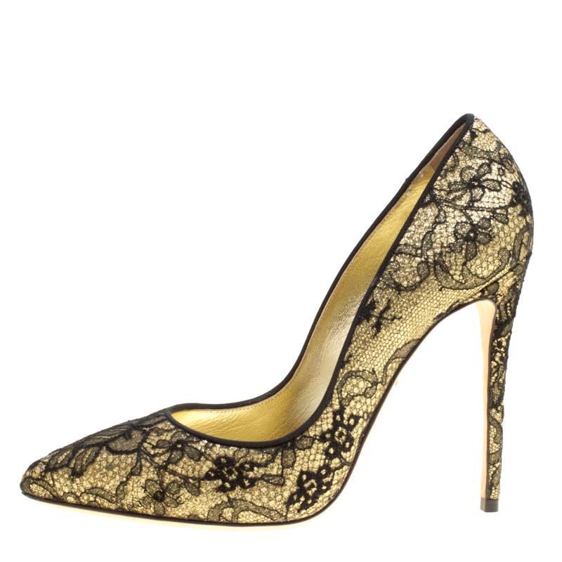 There's nothing that speaks elegance better than lace and that's why these pumps by Dolce and Gabbana are a dream worth owning. Beautifully designed with Chantilly lace and glitter, these metallic gold pumps flaunt pointed toes, stiletto heels, and
