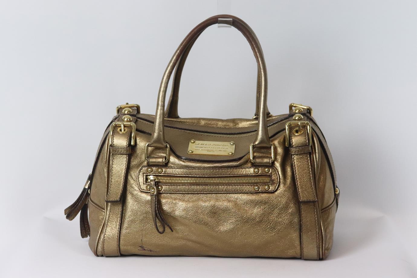 Dolce & Gabbana metallic leather shoulder bag. Bronze. Zip fastening at top. Does not come with dustbag or box. Height: 7.8 in. Width: 12 in. Depth: 8 in. Handle Drop: 8 in. Strap Drop: 14.1 in. Fair Condition - Wear to handles. Marks throughout