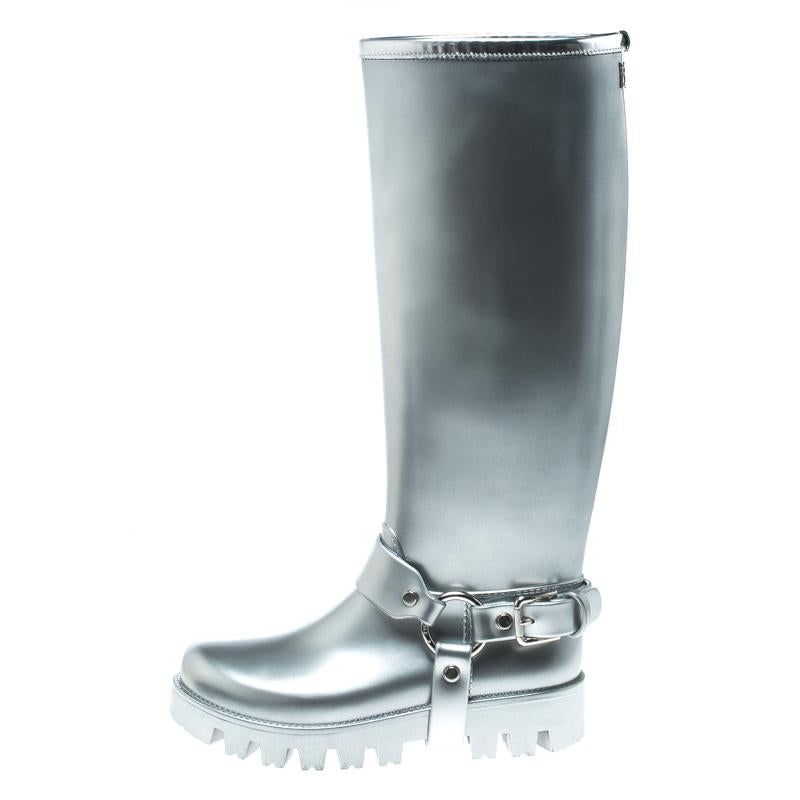 Show up on a rainy day with style in these rain boots from Dolce and Gabbana. They are made from metallic silver leather and designed with buckled belt details at the bottom and comfortable fabric lining on the insides. Because the base of the boots