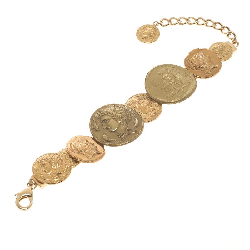 Garland your wrist with this stunner of a bracelet from Docle&Gabbana. The piece is crafted from gold-tone metal and designed as Sicily coins linked to one other. This bracelet can be worn with all your chic outfits.

Includes: Original Box,Original
