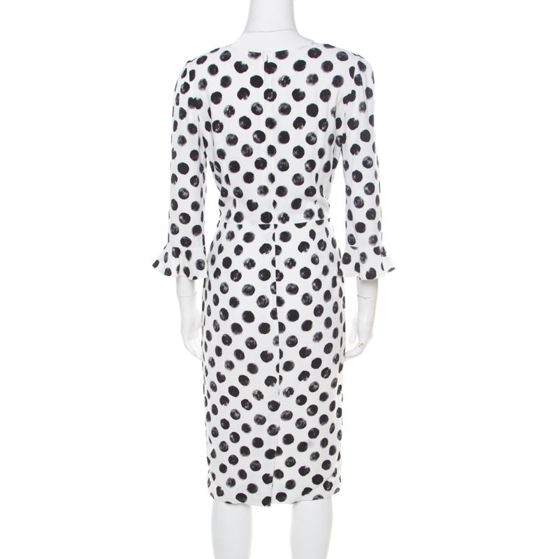 This Dolce & Gabbana dress is a creation for every woman. With stylish mid sleeves and sphere prints all over, this midi dress is a winner with pumps and sandals. It is made from the finest materials and bound to give you comfort with a high-fashion