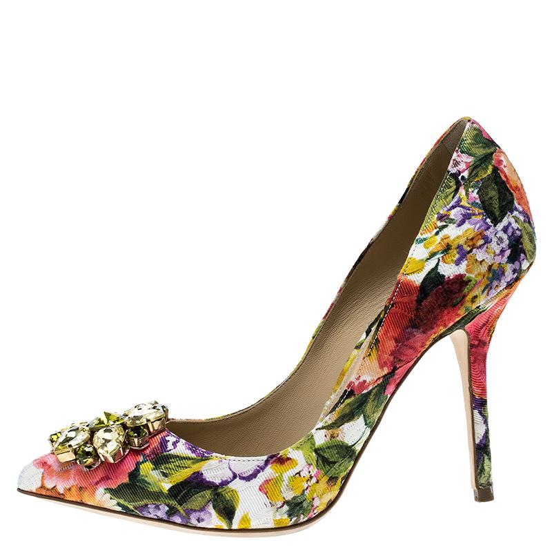Add these stunning Dolce and Gabbana pumps to your collection and be glamorously ready for those day time parties and events. Constructed in multicoloured floral printed fabric, these pointed toe pumps feature crystal embellished design at the front