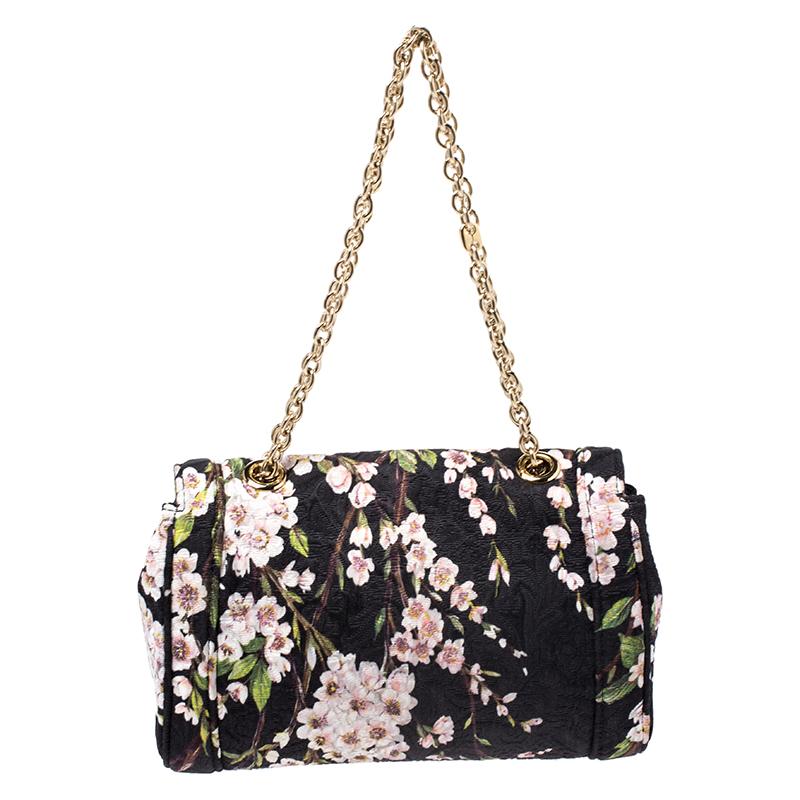 Every feature on this Dolce & Gabbana shoulder bag is delighting which makes the creation worthy of being owned. It has been crafted in Italy and made from a multicolored fabric styled with floral prints and a padlock. The bag has a shoulder strap