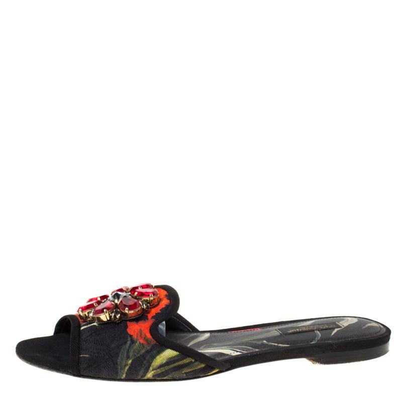 These Dolce and Gabbana slides are made with printed canvas while the insoles are lined with leather. What makes these slides so desirable are the breathtaking crystals embellished on the vamps. This is definitely one pair that speaks beauty in a