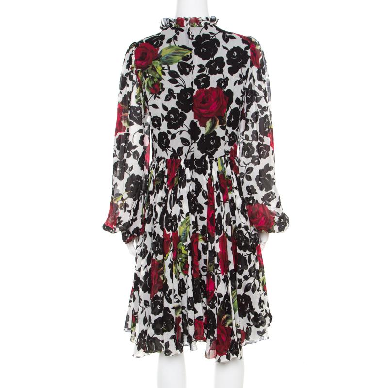 Amazingly stylish is this dress from Dolce and Gabbana! The multicolour creation is made of a silk blend and features a lovely rose print on it. It flaunts a pleated silhouette below the waist, a ruffled high neck and long sleeves. It is equipped