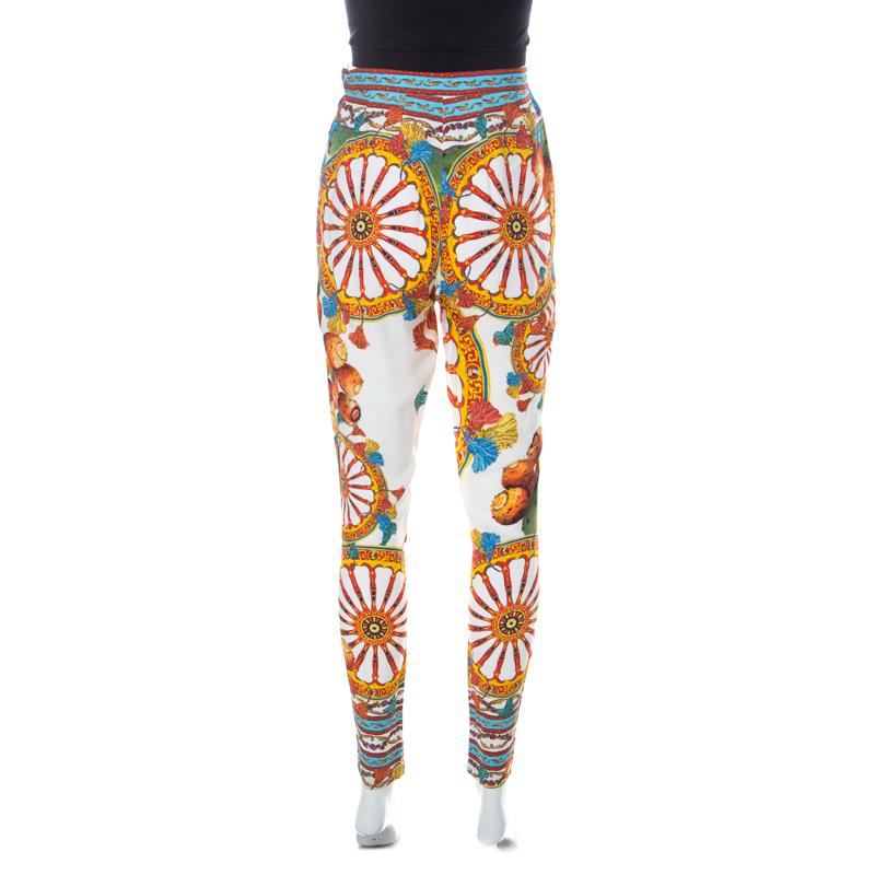 Dolce and Gabbana are known for clothes that exude strong feminity and charm. These pants feature the famous Sicilian print in eye-catching multicolours. Cut to a fine silhouette, they can be teamed up with a tank top to look casually