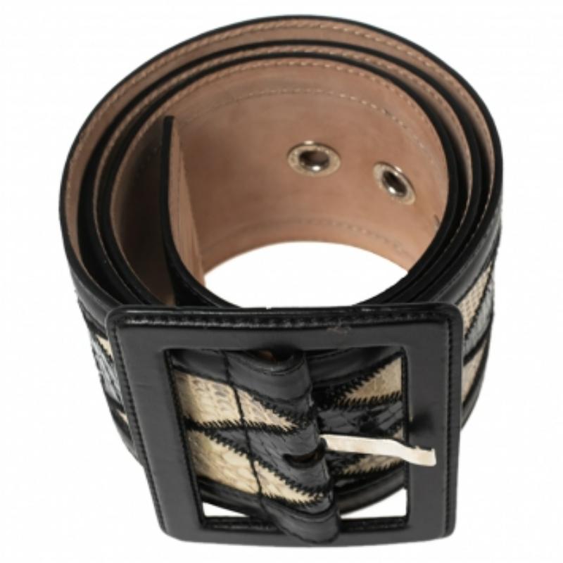A classic add-on to your collection of belts, this Dolce & Gabbana belt has been crafted from coated canvas and snakeskin in Italy. It has a lovely exterior and a square buckle. This piece carries a classy style, making it a wardrobe essential.