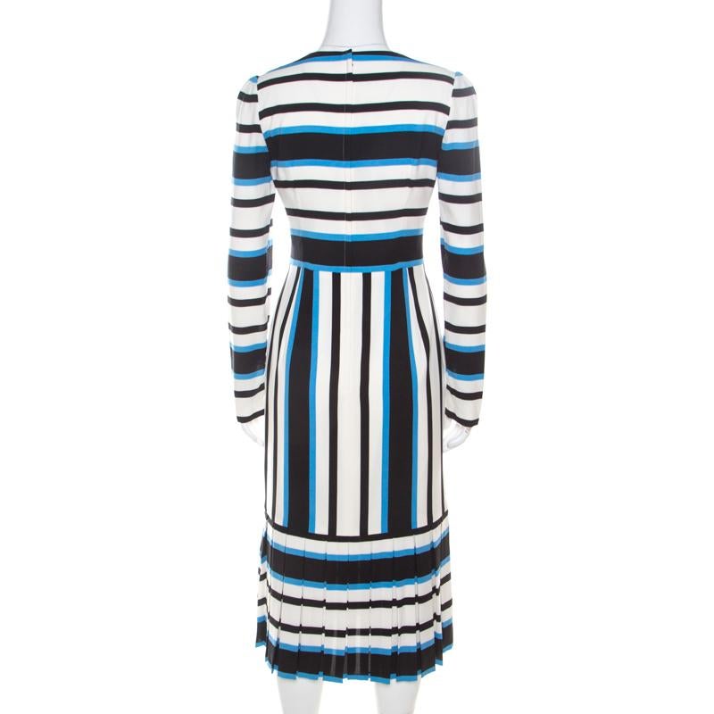 Ditch those normal designs and go for a statement-making style with this Dolce and Gabbana dress. Flawless and resplendent, you can always rely on this striped piece, be it any occasion. Tailored from a silk blend, this outfit has everything that