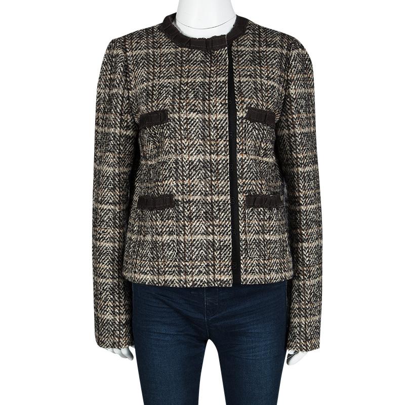 Dolce and Gabbana’s tweed jacket is a must-have in your wardrobe this season. Wool-herringbone pattern jacket is short and patterned with two breast pocket and concealed front fastening, jet pockets in the front, and long sleeves that keep the wind