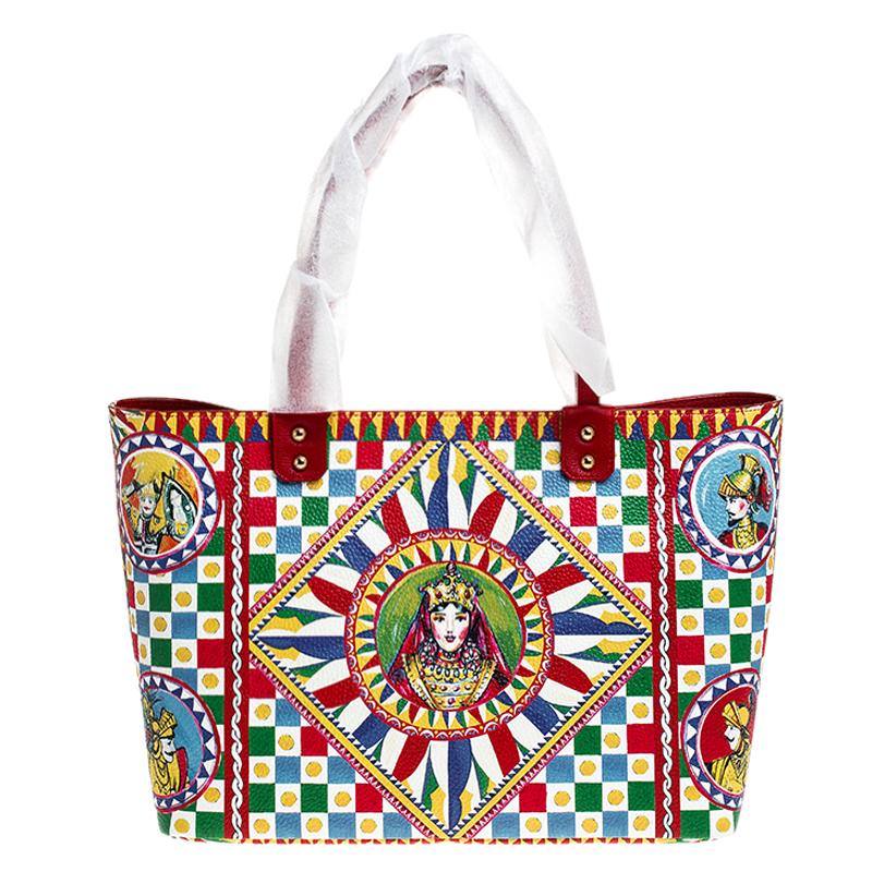 It really does take a few seconds to believe that there could be anything as chic as this Beatrice shopper tote from Dolce and Gabbana. It is crafted from leather and flaunts the iconic Sicilian print all over. It is held by two handles and features