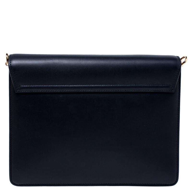 Make an astounding appearance by adorning this gorgeous navy blue leather bag. The leather-lined interior helps you keep your valuables intact without appearing bulky. This piece from Dolce & Gabbana will quench your love for a stylish