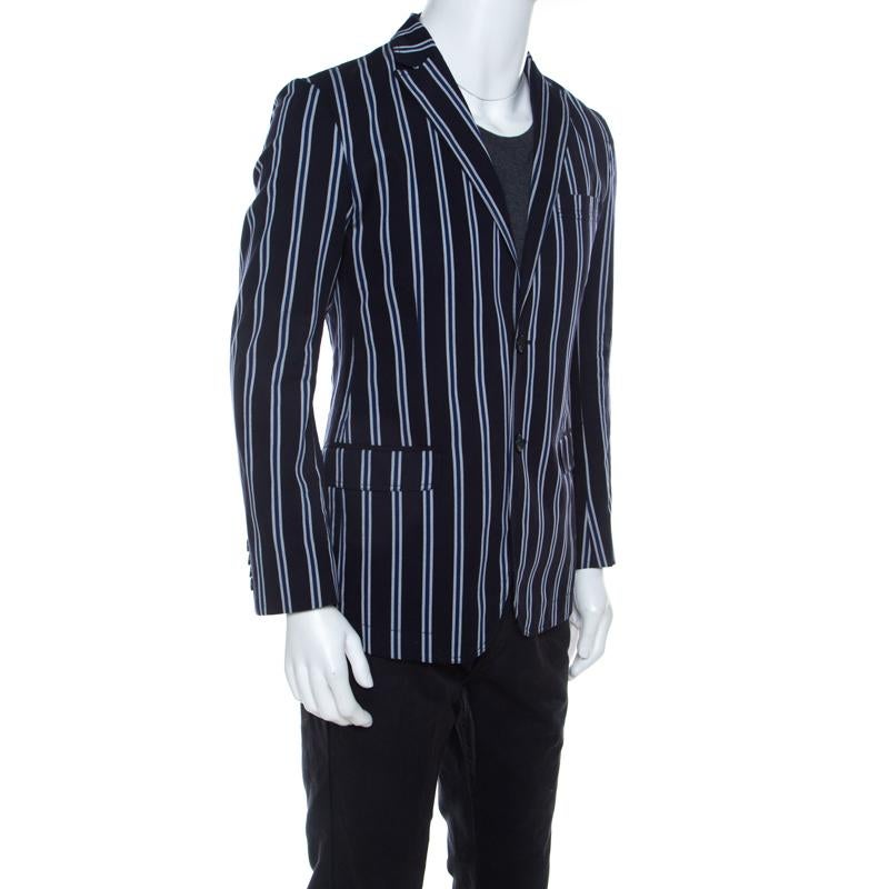 Add understated elegance to your formal ensemble with this blazer from Dolce And Gabbana. A well-tailored piece, this one is crafted with cotton featuring a striped pattern all over. It has two buttoned closure with stylish lapels and long sleeves.