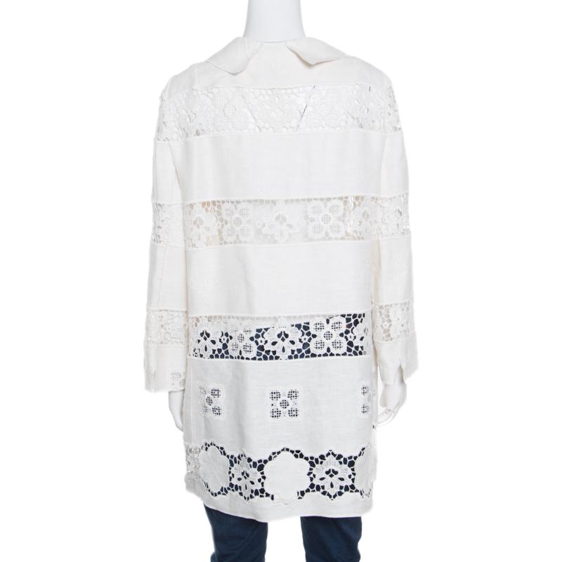 You're sure to fall in love with this long jacket from Dolce and Gabbana. Designed in a muted off-white hue, this jacket features long sleeves, concealed button fastenings, and feminine details like floral embroidery and lace inserts. The jacket,