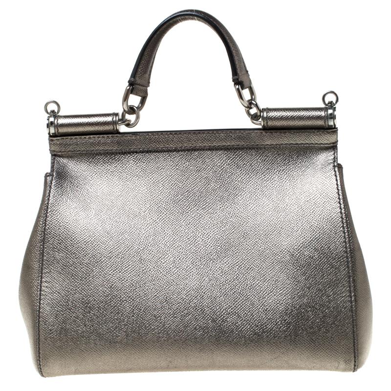 This gorgeous metallic olive green Miss Sicily bag from Dolce & Gabbana is a handbag coveted by women around the world. It has a well-structured design and a flap that opens to a compartment with fabric lining and enough space to fit your