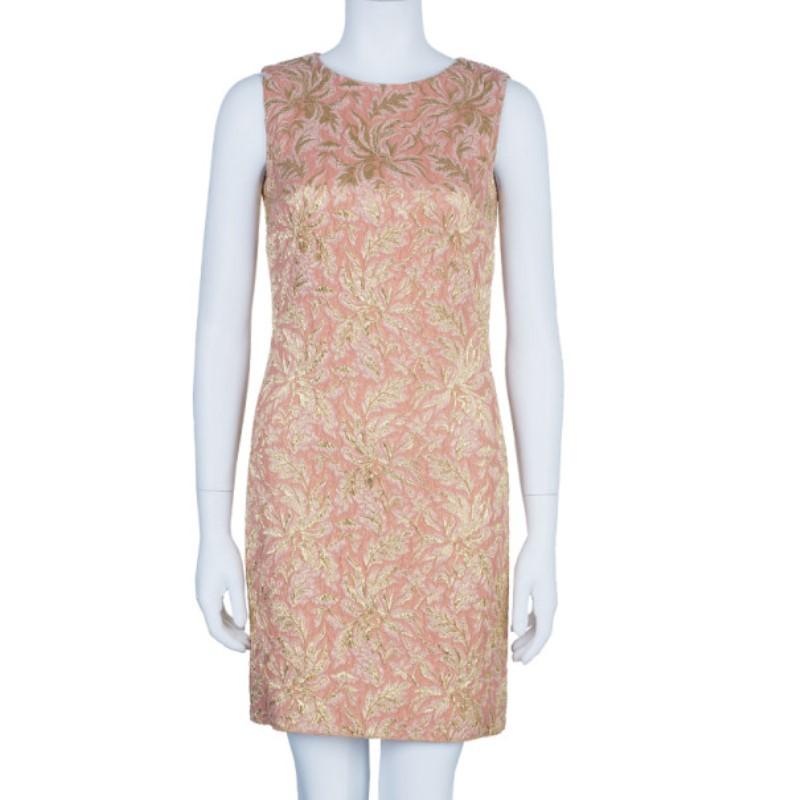 This dress is perfect for a formal lunch or dinner. The label returned to their classic, feminine roots with this gorgeous piece. It features a floral embossed exterior with a gold contrast that creates beautiful detailing. It also has no sleeves
