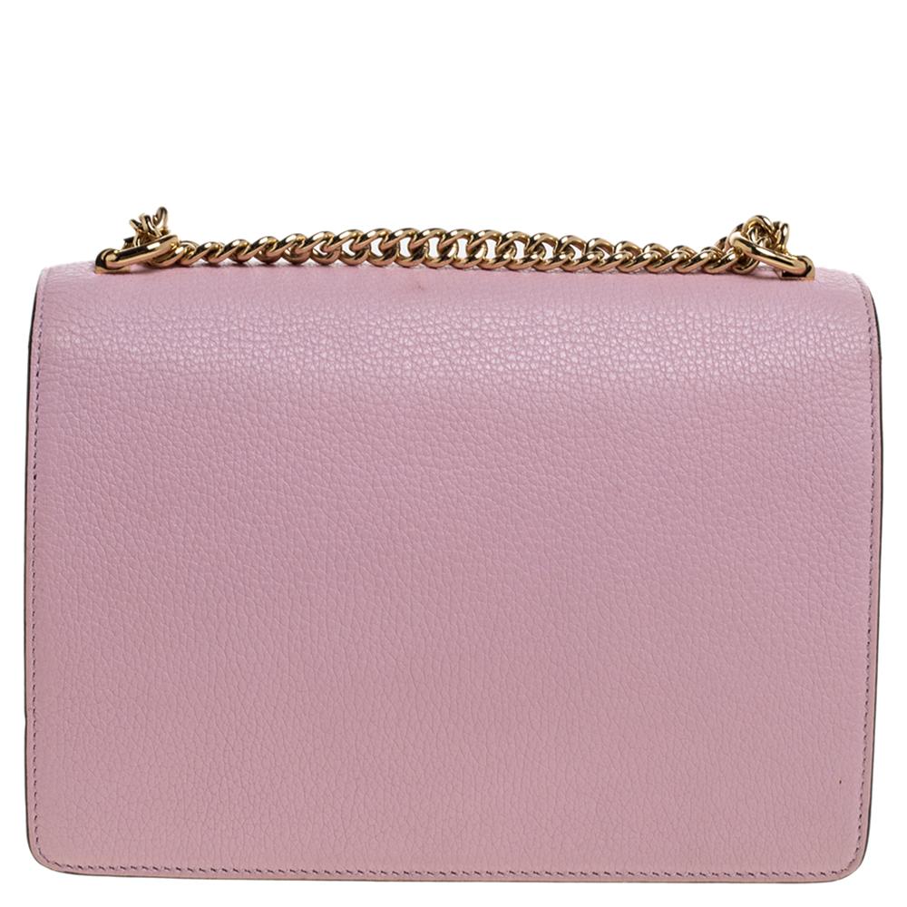 This chic Rosalia crossbody bag by Dolce & Gabbana will enhance both your casual and evening wear. Crafted from pink leather, it features a turn-lock closure on the front flap, an adjustable shoulder strap, and gold-tone hardware. The bag has a