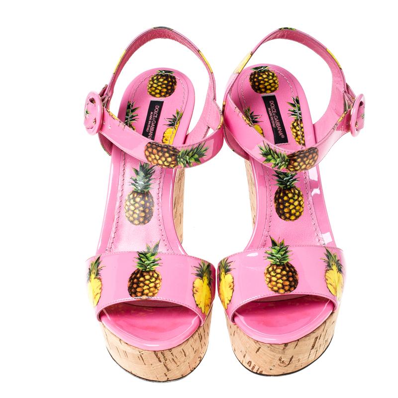 Dolce & Gabbana's fun-spirited vibe is evidently visible in these sandals. This girly and fun pair would complement your dresses and casual separates perfectly. They are crafted from patent leather and detailed with pineapple prints. They feature