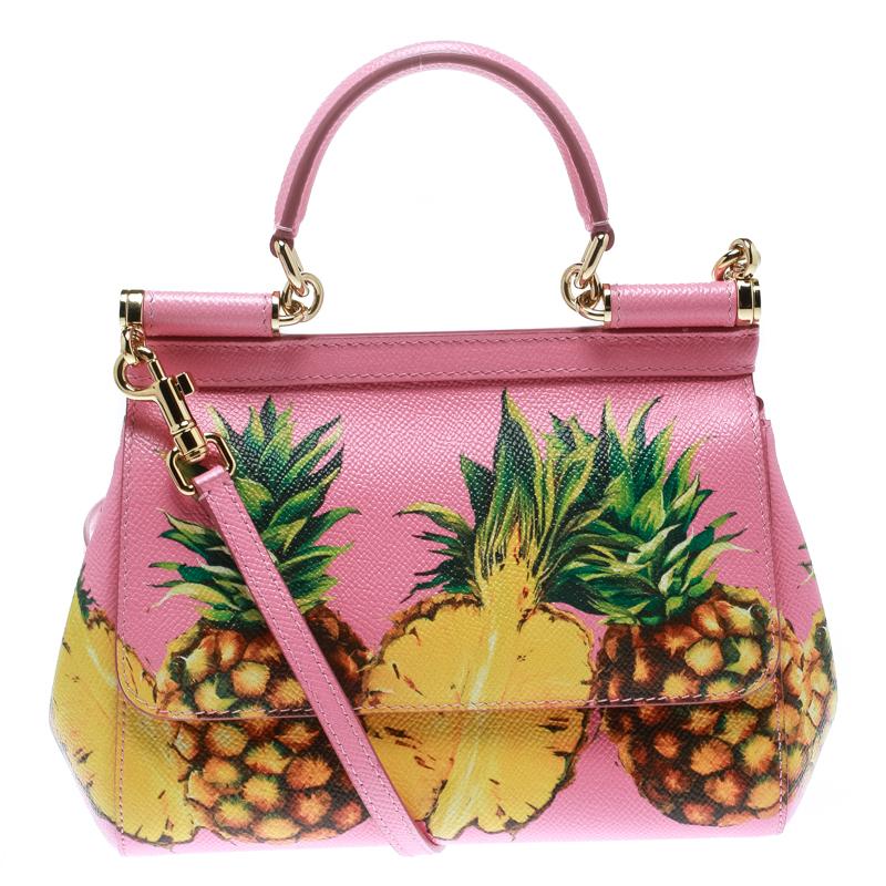 This gorgeous Pink Miss Sicily satchel from Dolce & Gabbana is a handbag coveted by women around the world. It has a well-structured design and a flap that opens to a compartment with Fabric lining and enough space to fit your essentials. The bag is