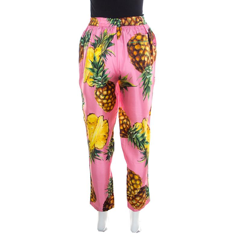 Beautifully made from silk, this pair of Dolce & Gabbana pyjama pants is designed with an elasticized waistband and vibrant pineapple prints all over. The comfortable creation will surely add a tropical touch to your wardrobe.

Includes: The Luxury