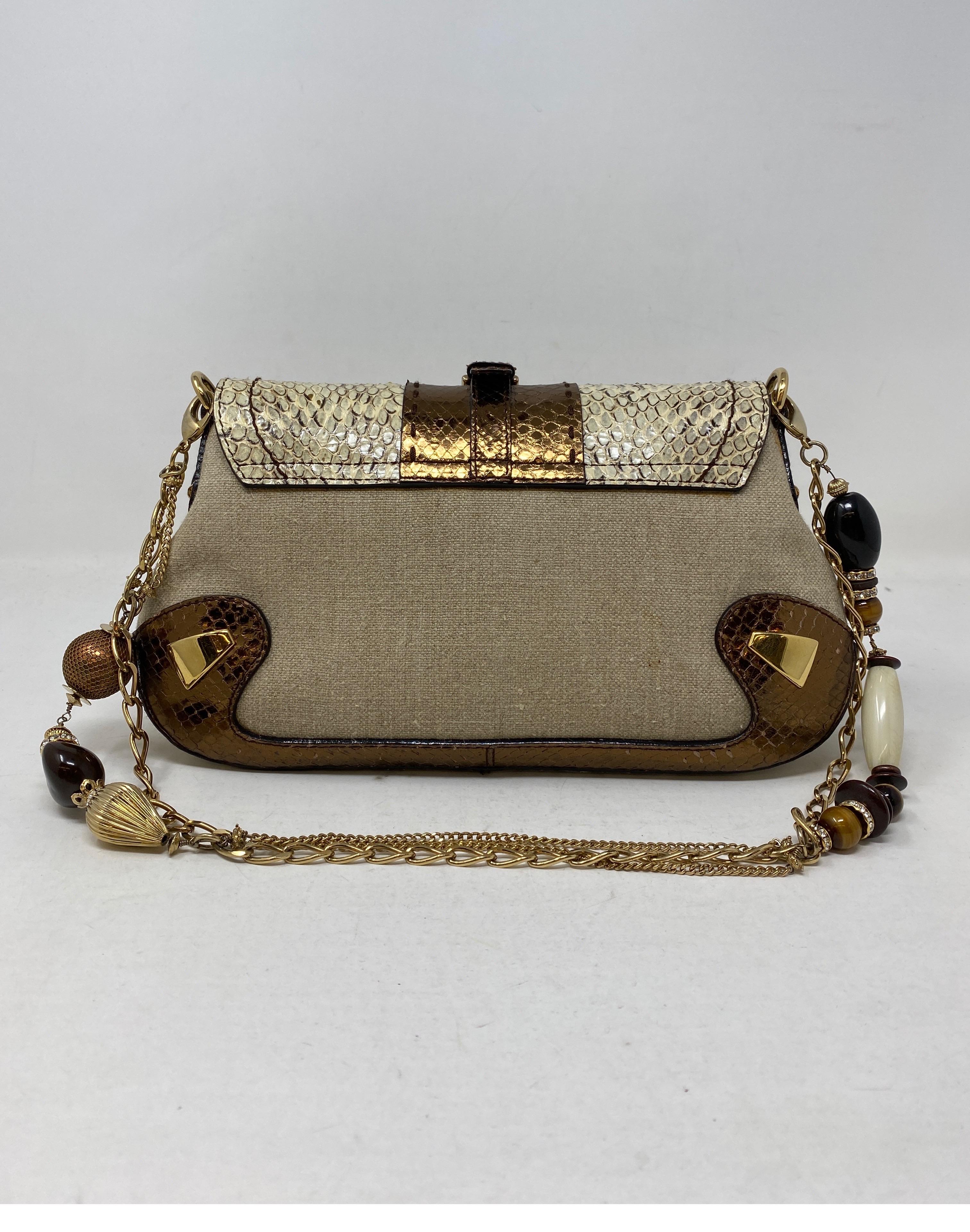 Dolce and Gabbana Python and Leather Bag. Canvas linen cloth bag with leather details. Unique gold chain with balls and ornaments. Mint condition. Can be worn as a clutch or as a shoulder bag. Gift worthy bag. Guaranteed authentic. 