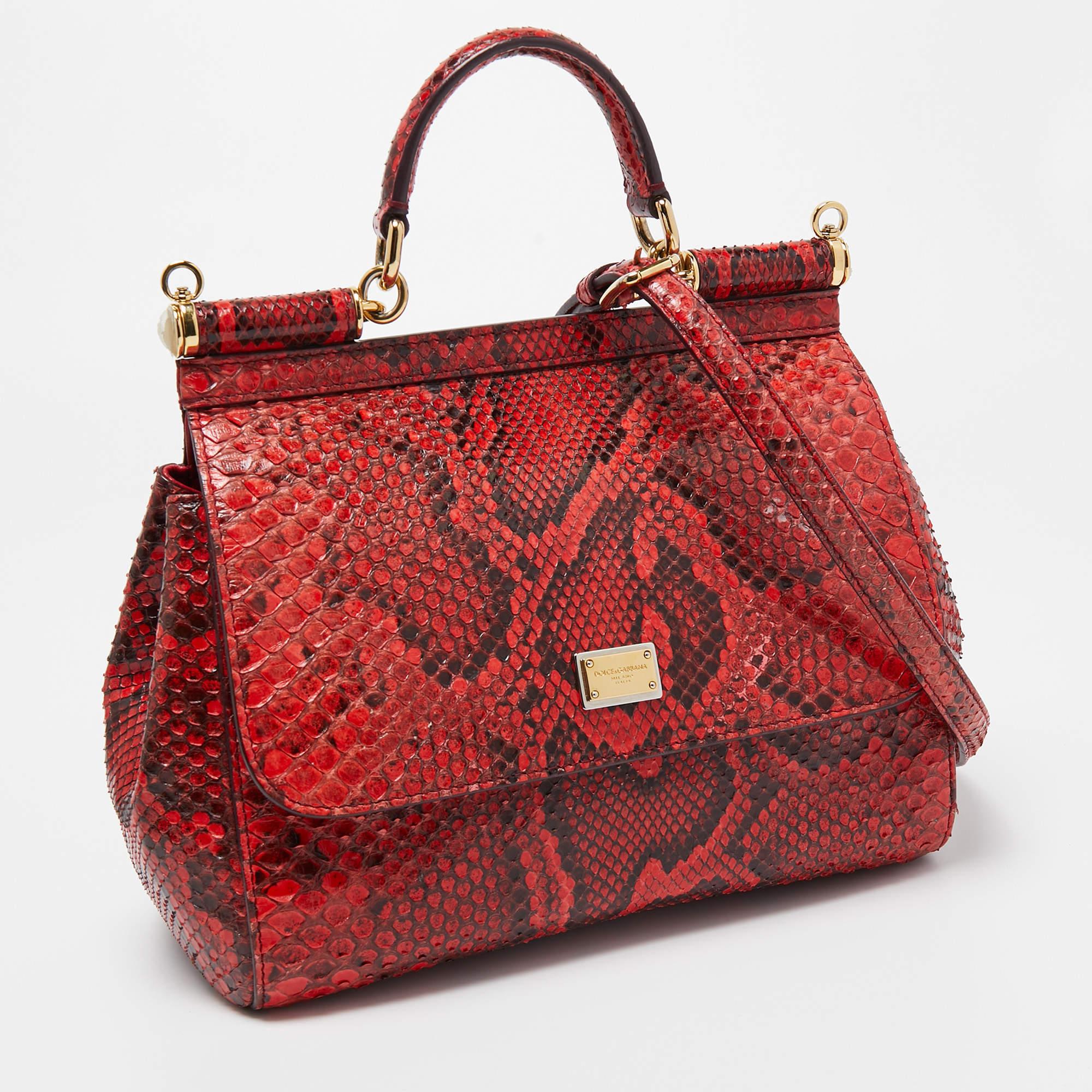 Presented for the 2009 Fall/Winter collection, Miss Sicily from Dolce & Gabbana represents the brand's regard for Italian essence and feminine style. This burgundy creation comes made from python skin and can be carried conveniently by a top handle