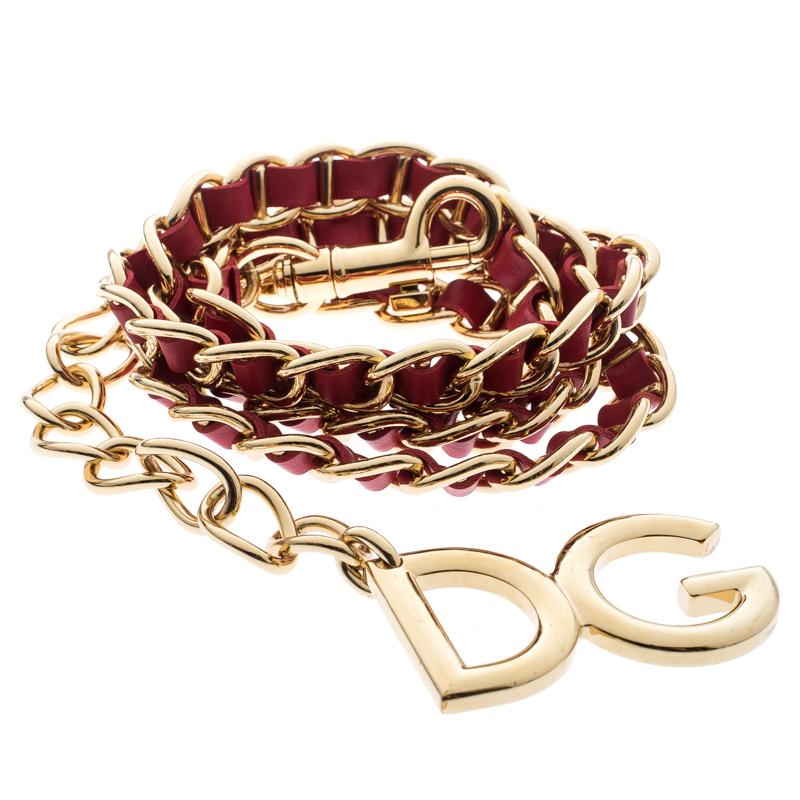 Step up your bling game with the Dolce and Gabbana chain belt. It features a gold-tone chain link and leather interlaced body along with DG letter charms. Complete with lobster clasp closure, the piece will look best with dresses and