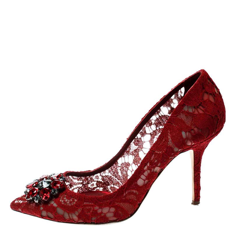 Deliver the most unforgettable looks in these red pumps from Dolce and Gabbana! From their shape and detailing to their overall appeal, they are utterly mesmerizing. The pumps are crafted from lace and mesh and decorated with crystals on their