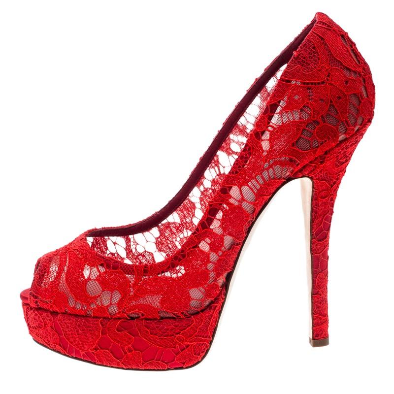 There's nothing that speaks elegance better than lace and that's why these pumps by Dolce & Gabbana are a dream worth owning. Beautifully designed with lace and mesh, these red pumps flaunt peep toes, 14 cm heels, and platforms. Strike the right