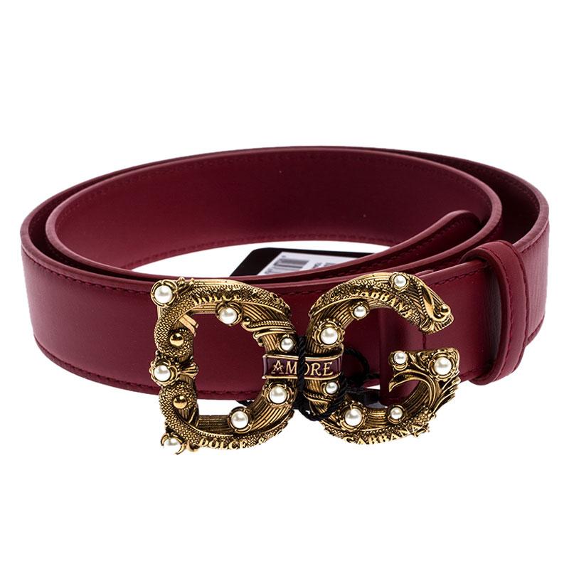 This Dolce&Gabbana belt has a magnificent DG Amore buckle in gold-tone metal embellished with faux pearls. Crafted from durable red leather, the belt has a single loop and it will easily add a luxe touch to your ensemble.

Includes
Info Booklet,