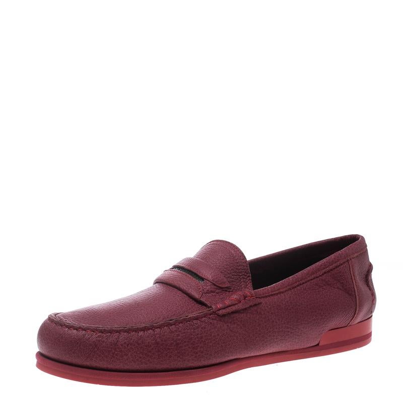 Dolce & Gabbana brings you these exquisite loafers that have been created with luxury in mind. They are covered in red leather and detailed with keeper straps and leather insoles meant to offer comfort in every step. The loafers are a result of a