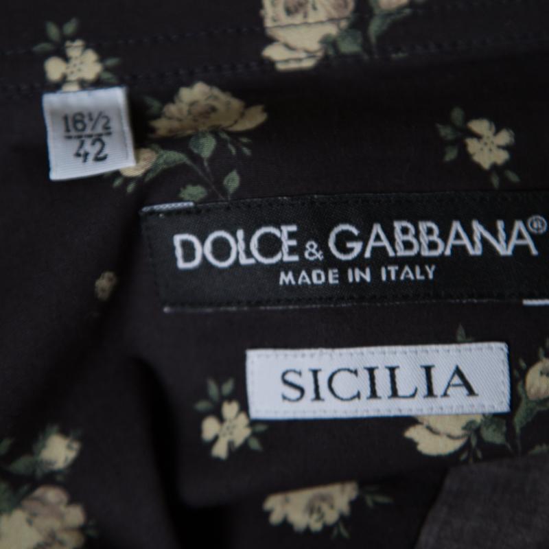 Exuding a fun finish, this Dolce and Gabbana shirt flaunts an eye-catching black hue and has a classic collar, long sleeves and buttoned closure. Crafted with cotton, the shirt is designed with an impressive floral print all over along, making the