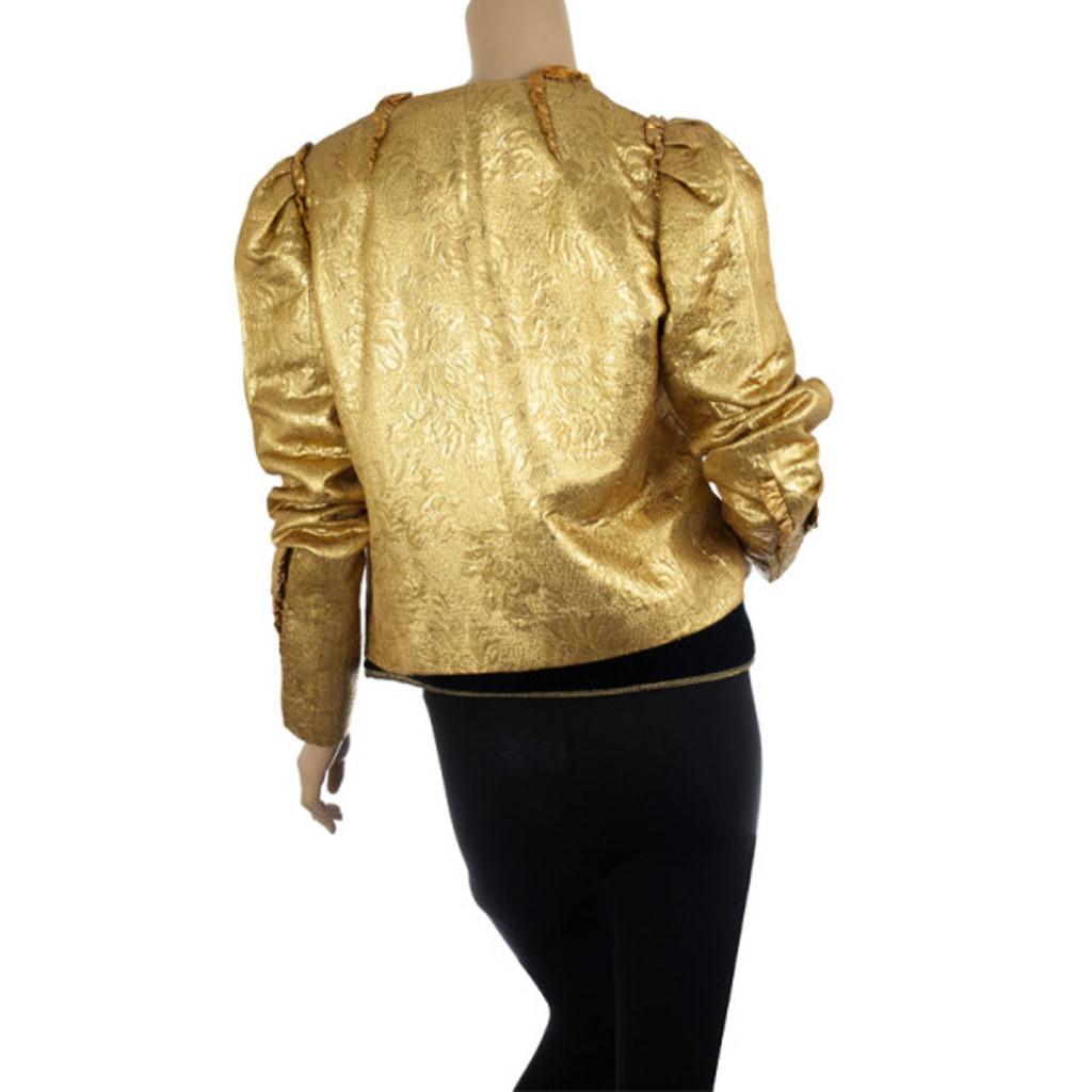 Add on this luxe jacket by Dolce and Gabbana to your evening outfit for a dazzling gold finish. This brocade jacket is lined with 100% silk and is accented with lambskin detailing at the neckline. 

Includes: The Luxury Closet Packaging
