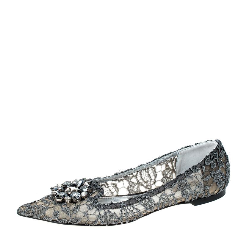 Classy and very stylish, these silver ballet flats from Dolce & Gabbana are worth every penny you spend! They are crafted from lace and mesh and feature a large, crystal embellishment on the vamps. They come fitted with leather-lined insoles, sturdy